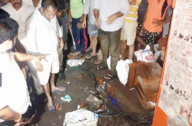 Locals at the site in Khindipada at Bhandup, where Sara Shaikh and Anil Yadav, who tried to help her, were electrocuted