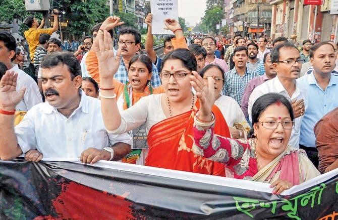 BJP Mahila Morcha President Locket Chatterjee (C) participates in a rally with party
