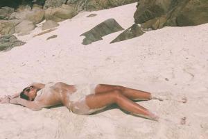 Mandana Karimi goes topless on beach, covers herself with sand. See photos!