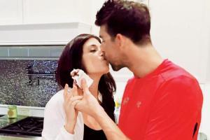 Michael Phelps kisses his wife in an adorable photo
