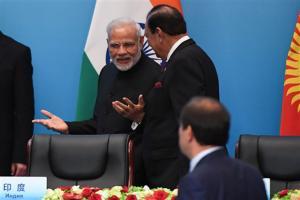 PM Narendra Modi, Pakistan President Mamnoon Hussain shake hands at SCO Summit
