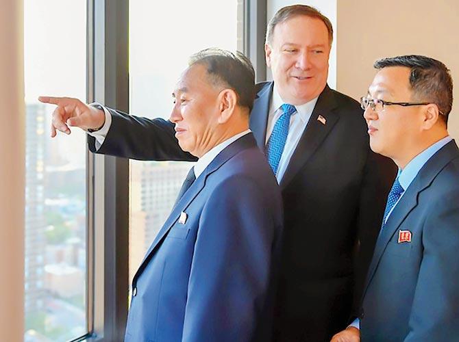 Kim Yong Chol (left) with Mike Pompeo (centre) in New York. Pics/AFP