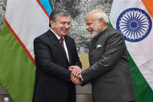 Narendra Modi meets Uzbek President Shavkat Mirziyoyev in China