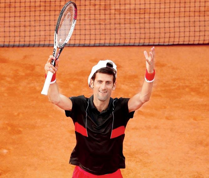 Novak Djokovic of Serbia celebrates his victory over Spain