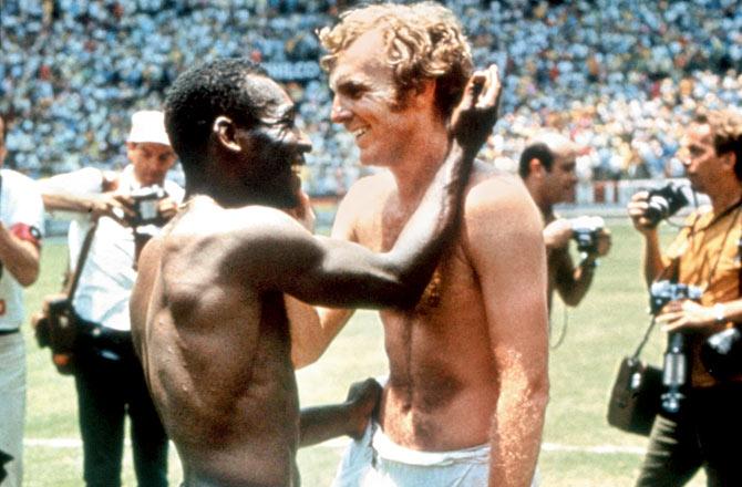 Brazilian legend Pele exchanges his shirt with England