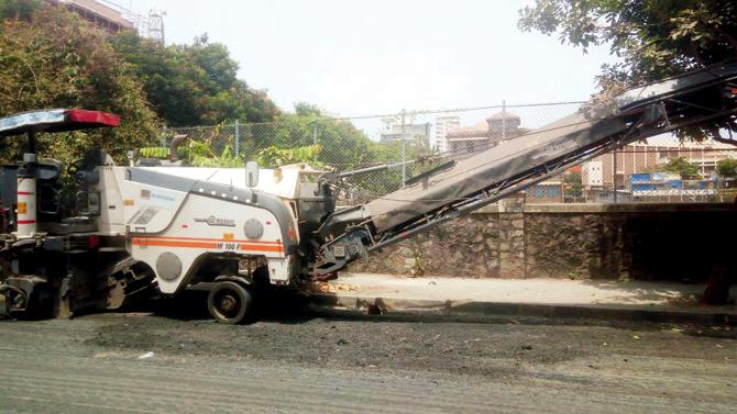 BMC workers relay the Bandra road after complaints of a shoddy job