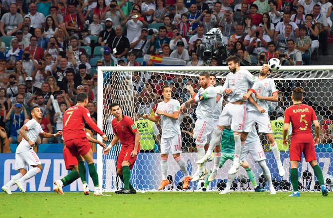 Ronaldo (second from left) nets his hat-trick from a free-kick