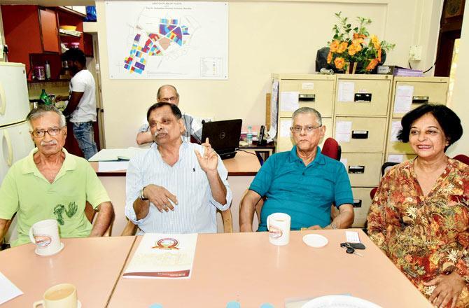 (From left) Secretary Eric Tellis, chairman Brenden D