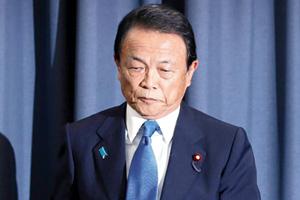 Japan Finance Minister returns year's salary over scandal
