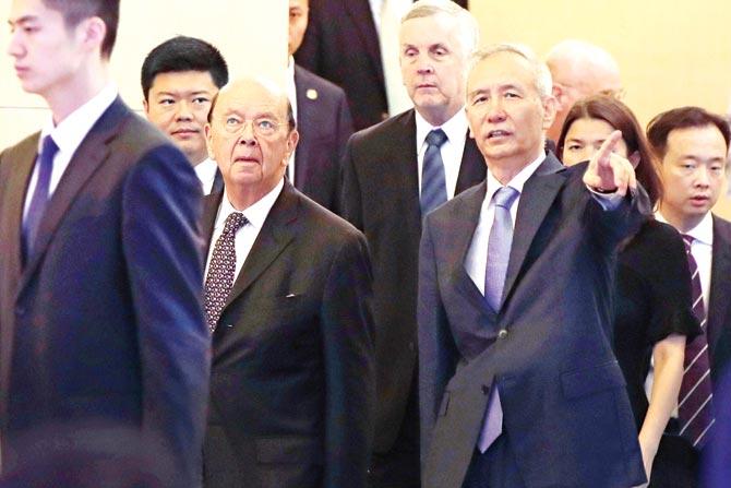 US commerce secretary Wilbur Ross (second from left) and Chinese Vice Premier Liu He, (right). Pic/AFP