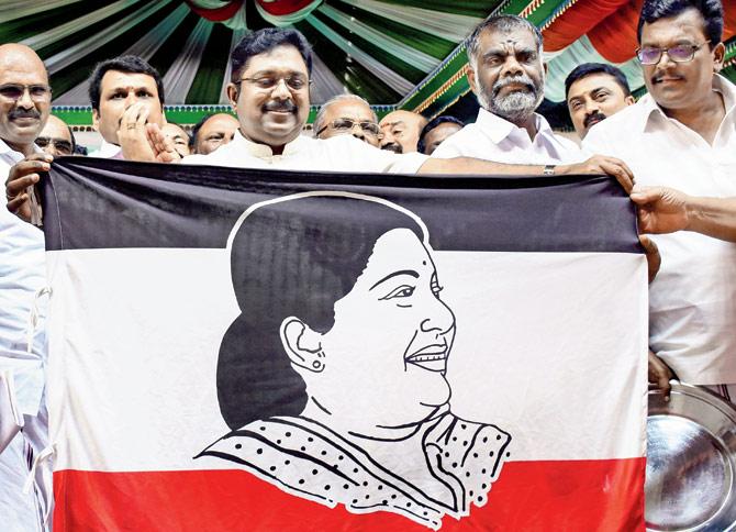 Sidelined AIADMK leader TTV Dhinakaran launches the party flag, which consists of a photo of J Jayalalithaa. Pic/PTI