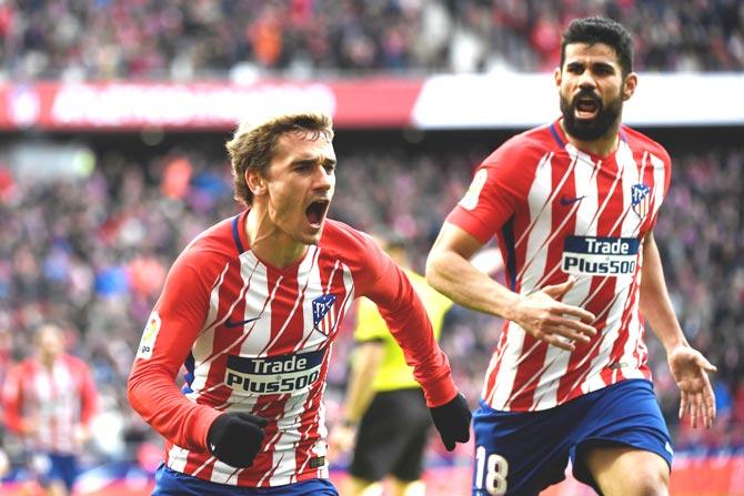 Atletico Madrid-s French forward Antoine Griezmann L celebrates with Atletico Madrid-s Spanish forward Diego Costa after scoring a goal during the Spanish league football match between Atletico Madrid and Celta Vigo at the Wanda Metropolitan stadium in Madrid. Pic/AFP