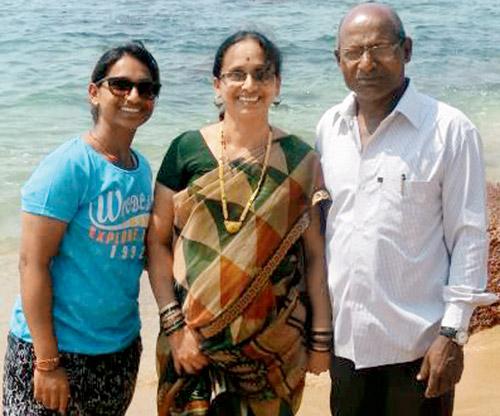 Anuja Patil (left) with mother Shobha and father Arun