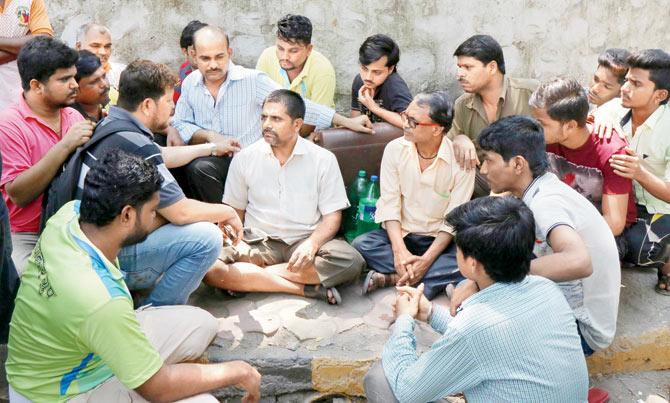Bramhadev Chaudhary, father of Sandeep (Below), with friends and neighbours outside his Chembur residence. Pics/RAajesh Gupta