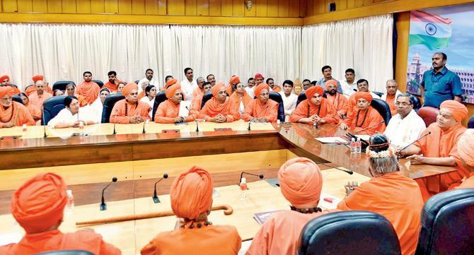 Karnataka Chief Minister Siddaramaiah meets the Lingayat community seers at Vidhana Soudha in Bengaluru on Sunday. Pic/PTI Karnataka Chief Minister Siddaramaiah meets the Lingayat community seers at Vidhana Soudha in Bengaluru on Sunday. Pic/PTI