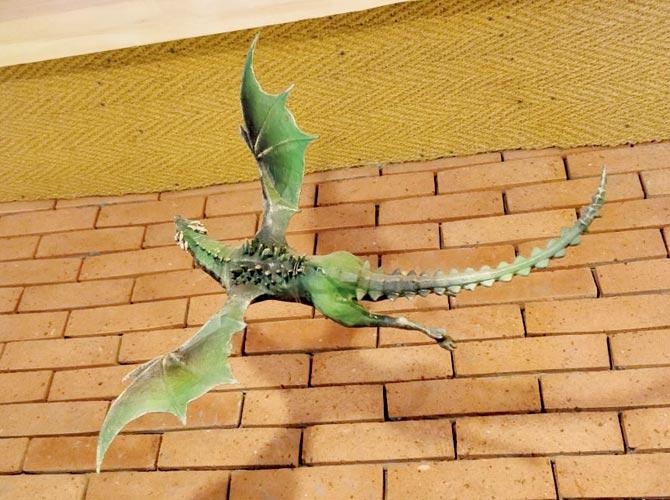 A miniature dragon suspended from the ceiling
