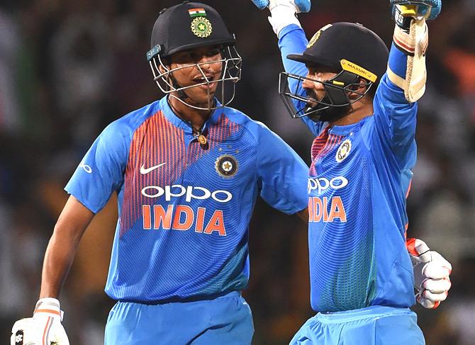 Indian cricketer Dinesh Karthik (R) and Washington Sundar (L) react after scoring the winning run to defeat Bangladesh by 4 wickets during the final Nidahas Twenty20 Tri-Series international cricket match between India and Bangladesh at the R. Premadasa stadium in Colombo on March 18, 2018. Pic/AFP