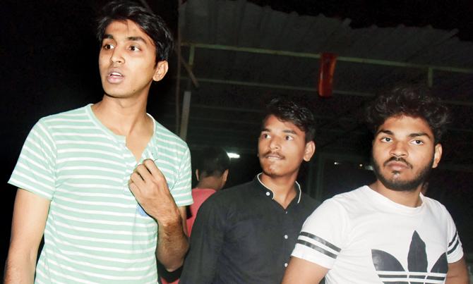 Even as his friends and relatives (right gather at the spot on Monday evening. Pics/Sameer Markande