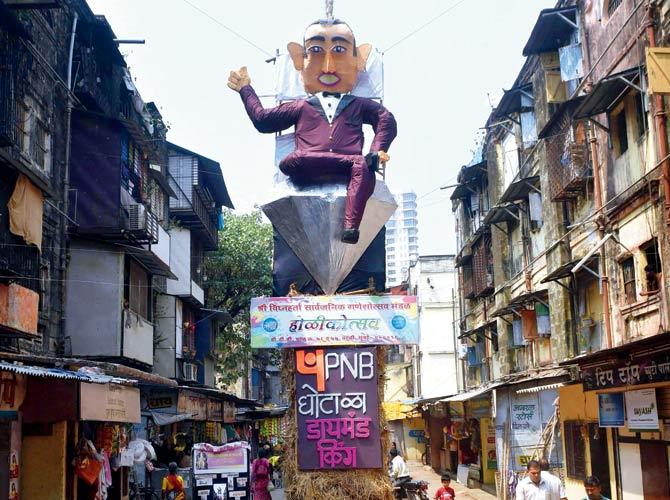 Nirav Modi has fled the country, but Mumbaikars got a little taste of vengeance by burning a 58-foot effigy of the scamster as part of Holika dahan on Thursday. Pic/PTI