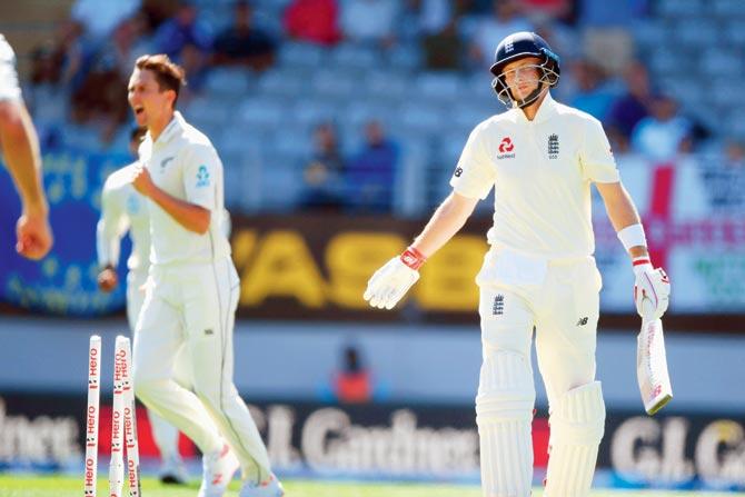 England skipper Joe Root is dejected after being dismissed by  NZ pacer Trent Boult (left) for a duck in Auckland yesterday. PIC/GETTY IMAGES