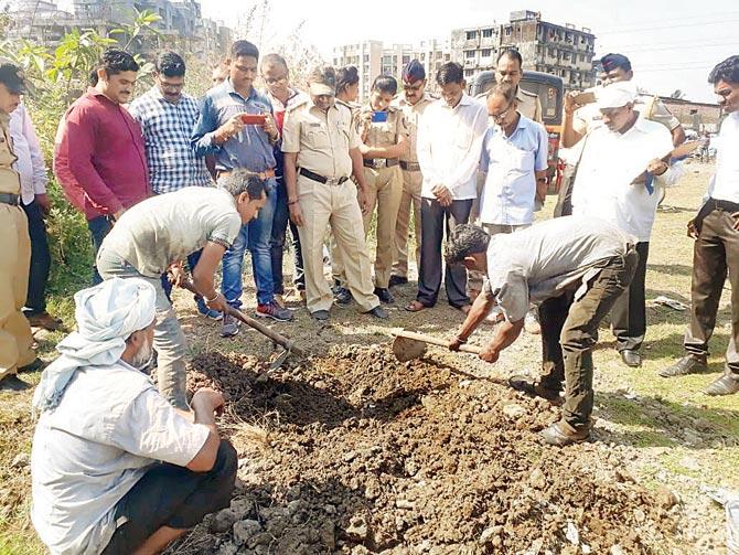 Cops dig up the spot from where a dog