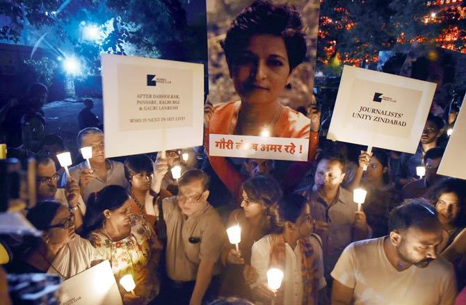 Mumbai Press Club along with other media organisations had staged a candlelight vigil last year seeking justice for Lankesh. File pics