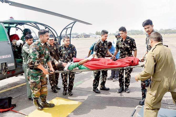 A person injured in the cross-border shelling between Indian and Pakistani troops being airlifted to the Government Medical College hospital by the helicopter unit crew, in Jammu on Sunday. Pic/PTI