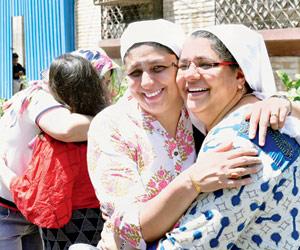 Parsi community greet each other on the occasion of Navroz at the Tardeo agiary 