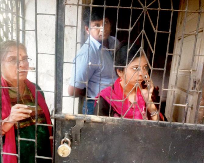 Prajakta (on the phone), her cousin and mother were locked in the balcony of their Kurla home