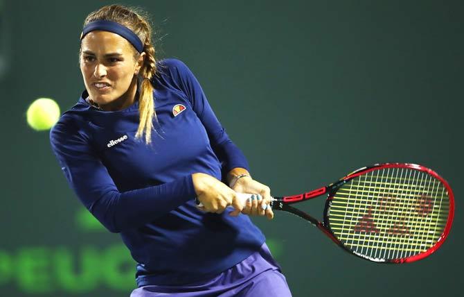 Monica Puig of Puerto Rico in action against Samantha Stosur of Australia in their first round match during the Miami Open Presented by Itau at Crandon Park Tennis Center in Key Biscayne, Florida. Pic/AFP