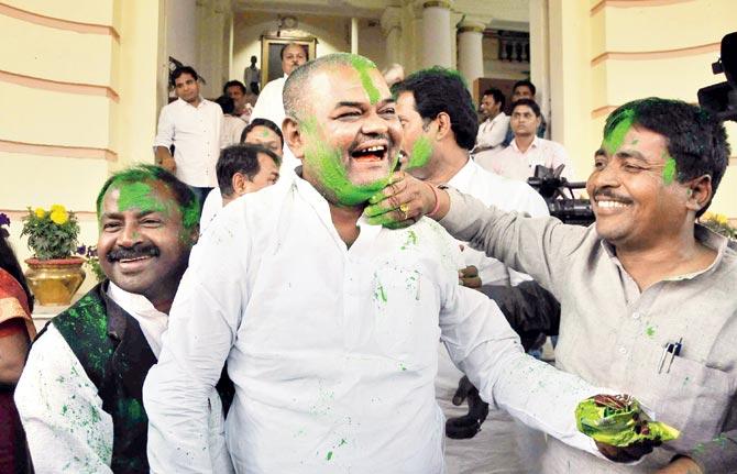 RJD legislators celebrate after the success of their party in Lok Sabha and Assembly by-polls outside Bihar Assembly in Patna. Pic/PTI