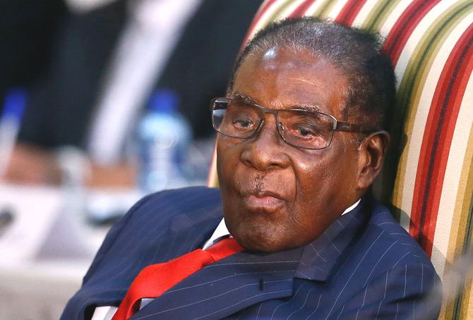 In this file photo taken on October 03, 2017 Zimbabwean President Robert Mugabe attends the 2nd Session of the South Africa-Zimbabwe binational Commission (BNC) at Sefako Makgatho Presidential Guest House in Pretoria. Former Zimbabwean president Robert Mugabe described his departure from office in November as a "coup d