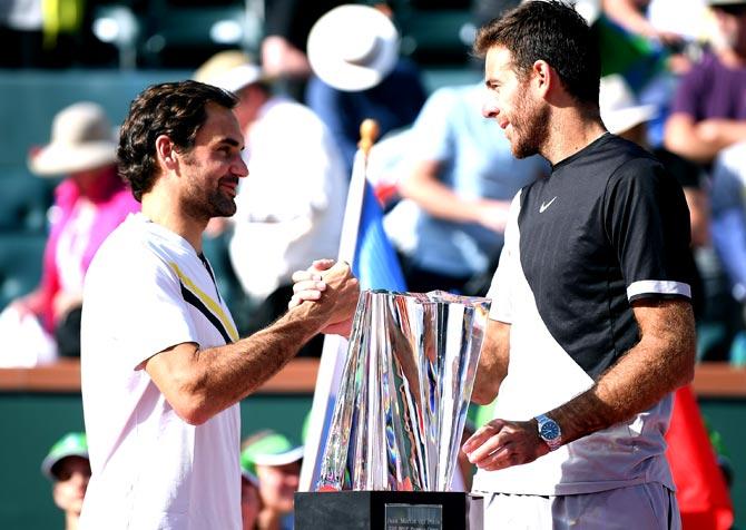 Juan Martin Del Potro of Argentina shakes hands with Roger Federer of Switzerland at the trophy presentation after a three set victory in the ATP final during the BNP Paribas Open at the Indian Wells Tennis Garden. Pic/AFP
