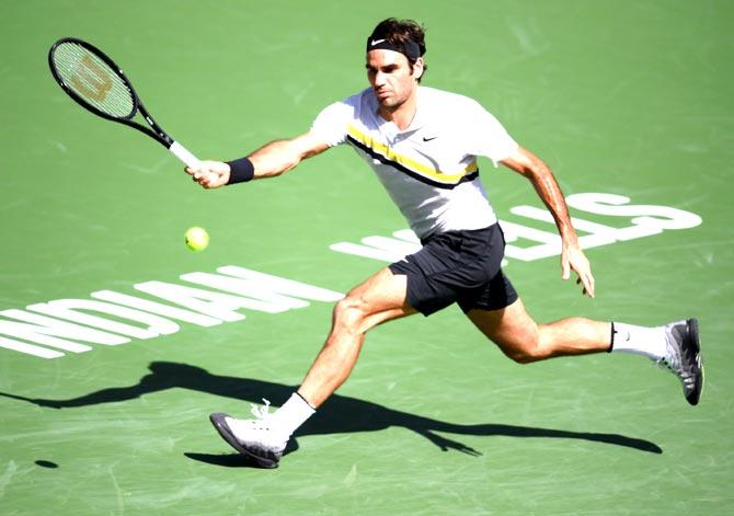 Roger Federer of Switzerland hits a running forehand in his match against Filip Krajinovic of Serbia during the BNP Paribas Open at the Indian Wells Tennis Garden in Indian Wells. Pic/AFP