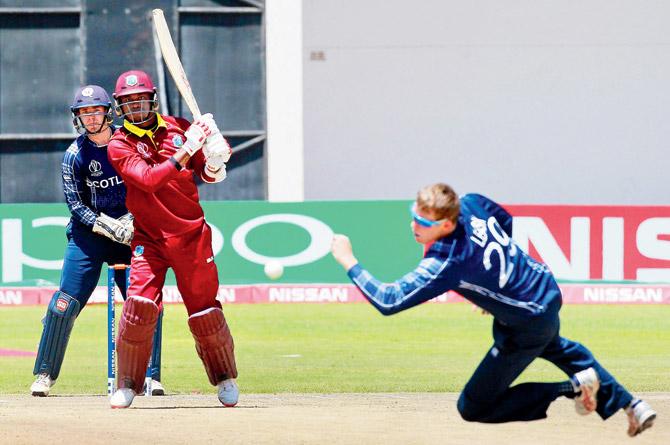 West Indies batsman Marlon Samuels en route his 51 against Scotland during the World Cup Qualifier at Harare yesterday. Pic/AFP