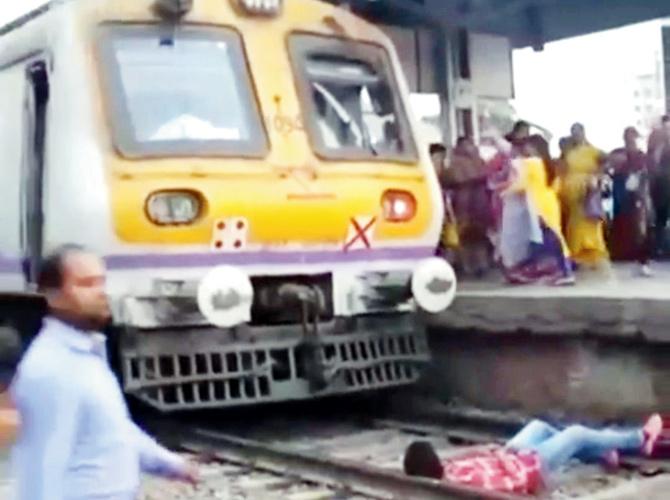 In another, he is seen lying on the tracks