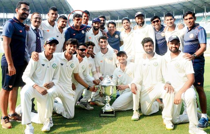 The Vidarbha team pose with the Irani Cup after their win over Rest of India yesterday; (encircled) bowling coach Subroto Banerjee. Pics/PTI