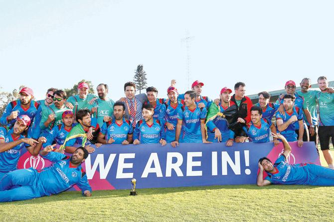 Afghanistan players celebrate in Harare yesterday after beating Ireland to qualify for next year’s World Cup. PIC/ICC