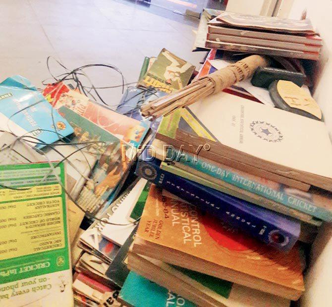 Valuable books from the Kanga Library strewn near the press conference room at Wankhede on Tuesday. Pic/Subodh Mayure