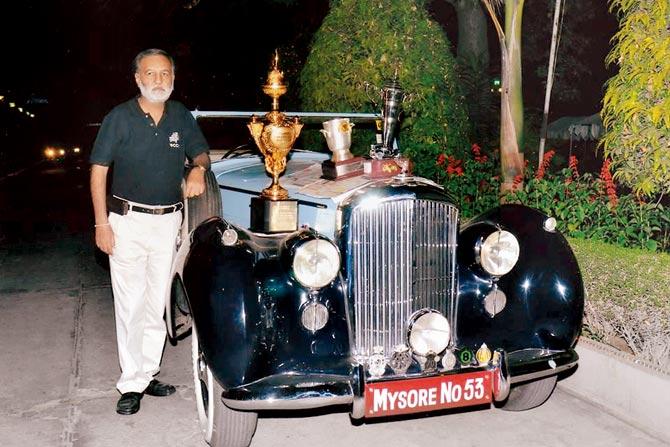Nitin Dossa with an award-winning vintage car