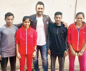 MS Dhoni spends time, gifts bat for tribal runners in Maharashtra