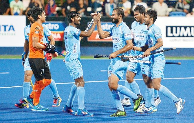 Indian players celebrate a goal against Malaysia yesterday