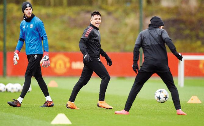 Man United players during a training session on the eve of their Champions League Last-16 tie against Sevilla in Manchester yesterday. Pic/AFP