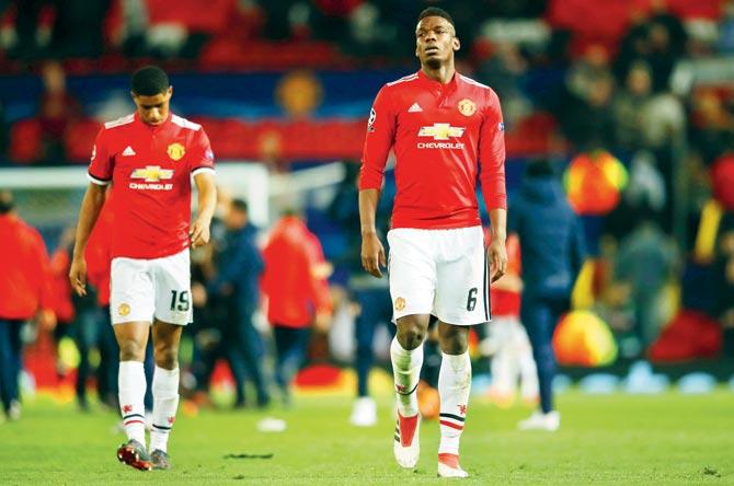 Dejected Marcus Rashford (left) and Paul Pogba after Man United