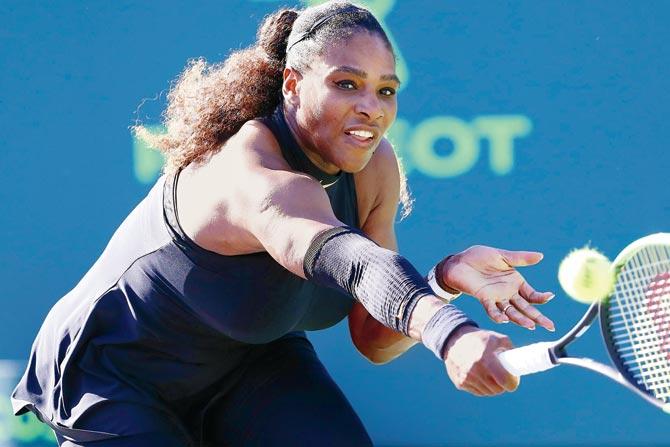 USAs Serena Williams returns to Japan’s Naomi Osaka in the first round of the Miami Masters in Florida on Wednesday. pic/AFP