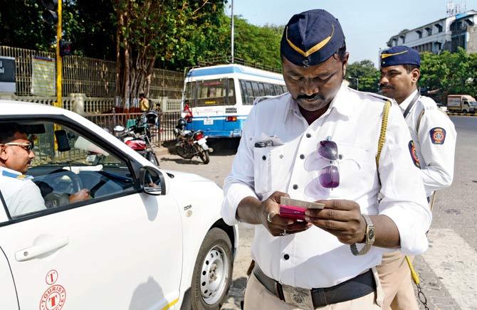 The traffic police believe that linking Aadhaar details will help them to identify offenders and detect fake licences. Representation pics
