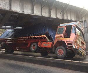 Mumbai: Cargo container truck meets with accident at King Circle railway bridge
