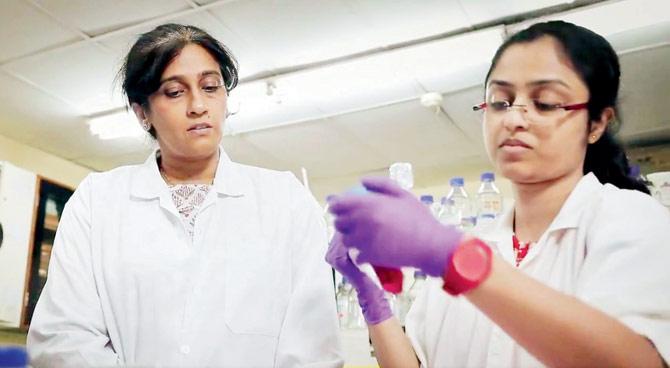 Vidita Vaidya (left) at work in the neurobiology lab