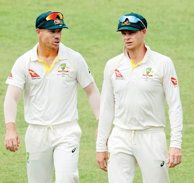 Oz opener David Warner and skipper Steven Smith on Day Five of the first Test against South Africa in Durban yesterday. Pic/Getty Images