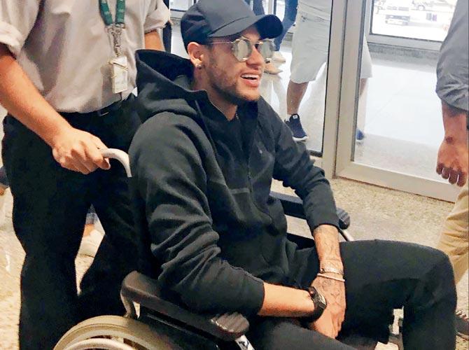 A wheelchair-bound Neymar Jr arrives at the Rio de Janeiro  airport on Thursday. Pic/AFP 